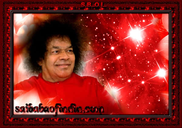 Sri Sathya Sai Baba smiling wearing Maroon Robe