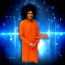 sathya-sai-baba-tanding-smiling-looking